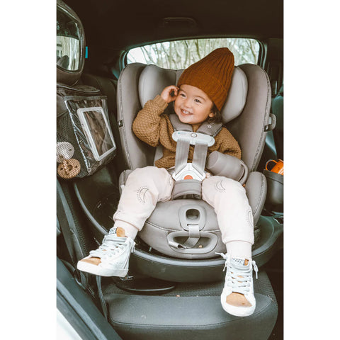 Happy Child in Rotating Car Seat