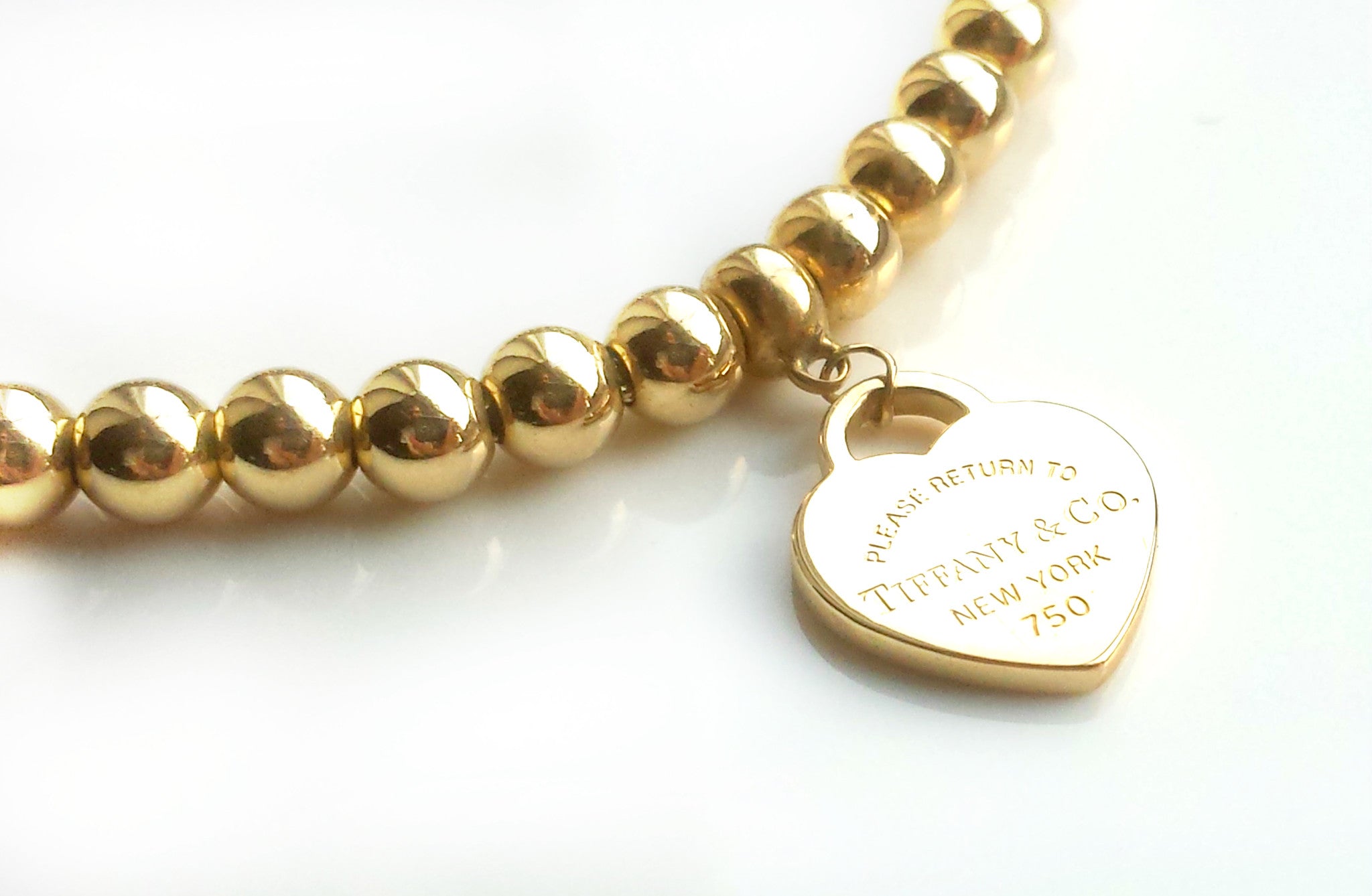 Tiffany & Co. Return to 18k Yellow Gold Bead Bracelet & Mini Heart Tag