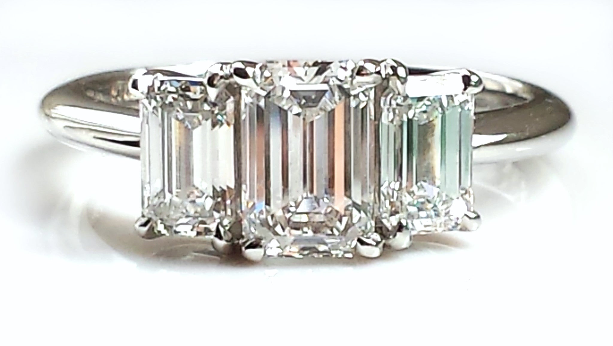 3 stone emerald cut engagement rings