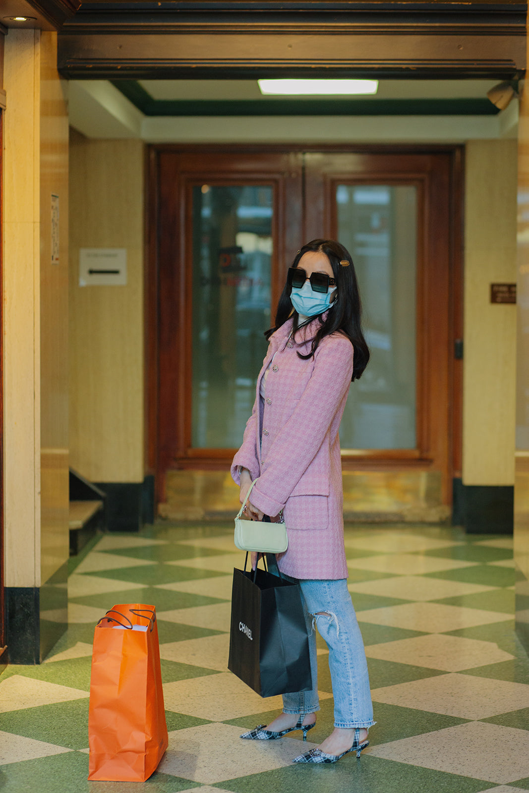 Chelsea waits in the Love that Bag etc Vancouver lobby