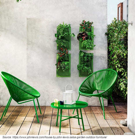 Small bistro set in a small garden setting.