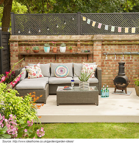 corner sofa in a small garden setting