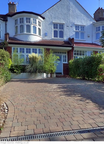 house with block paving driveway