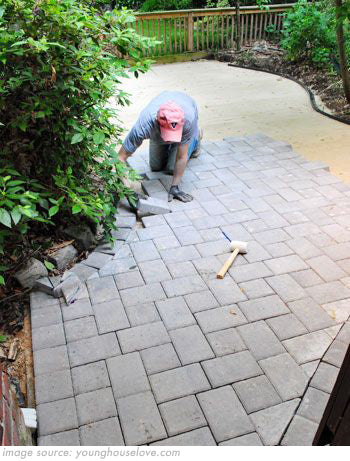 paving slabs being laid in garden