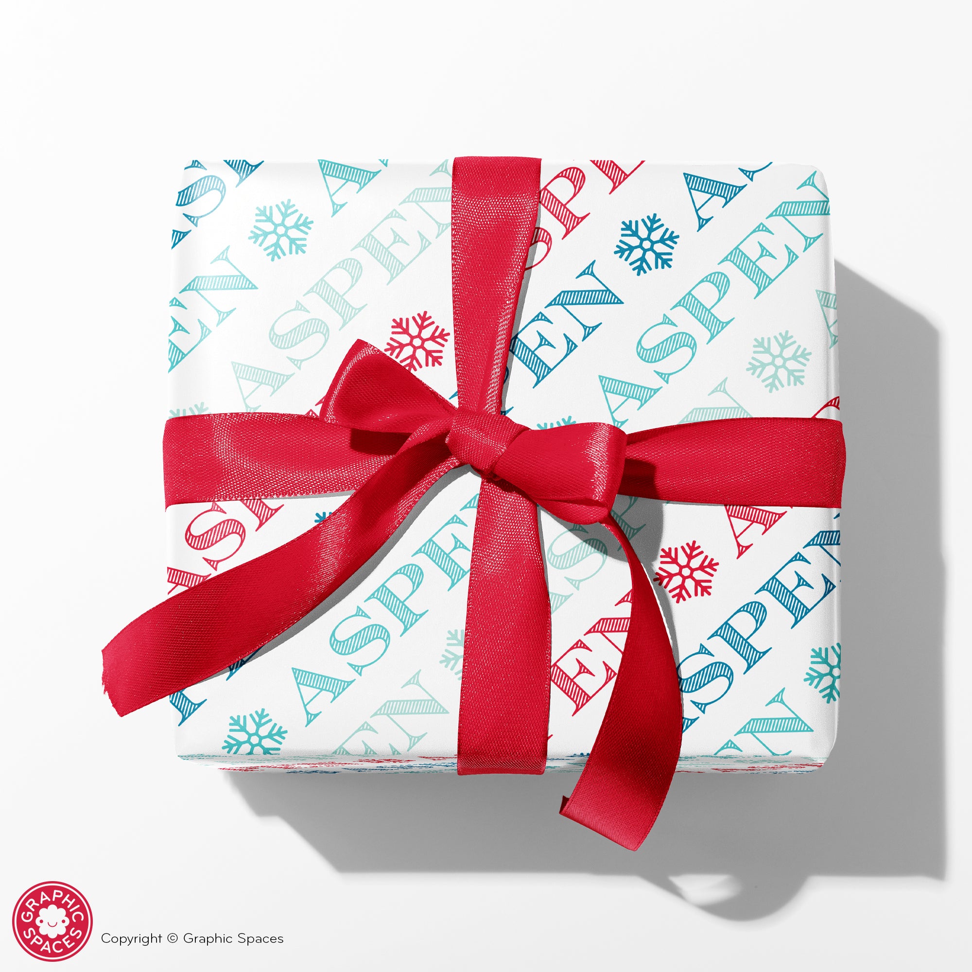 Winter gift wrap package snowflake print, bow, and personal note card