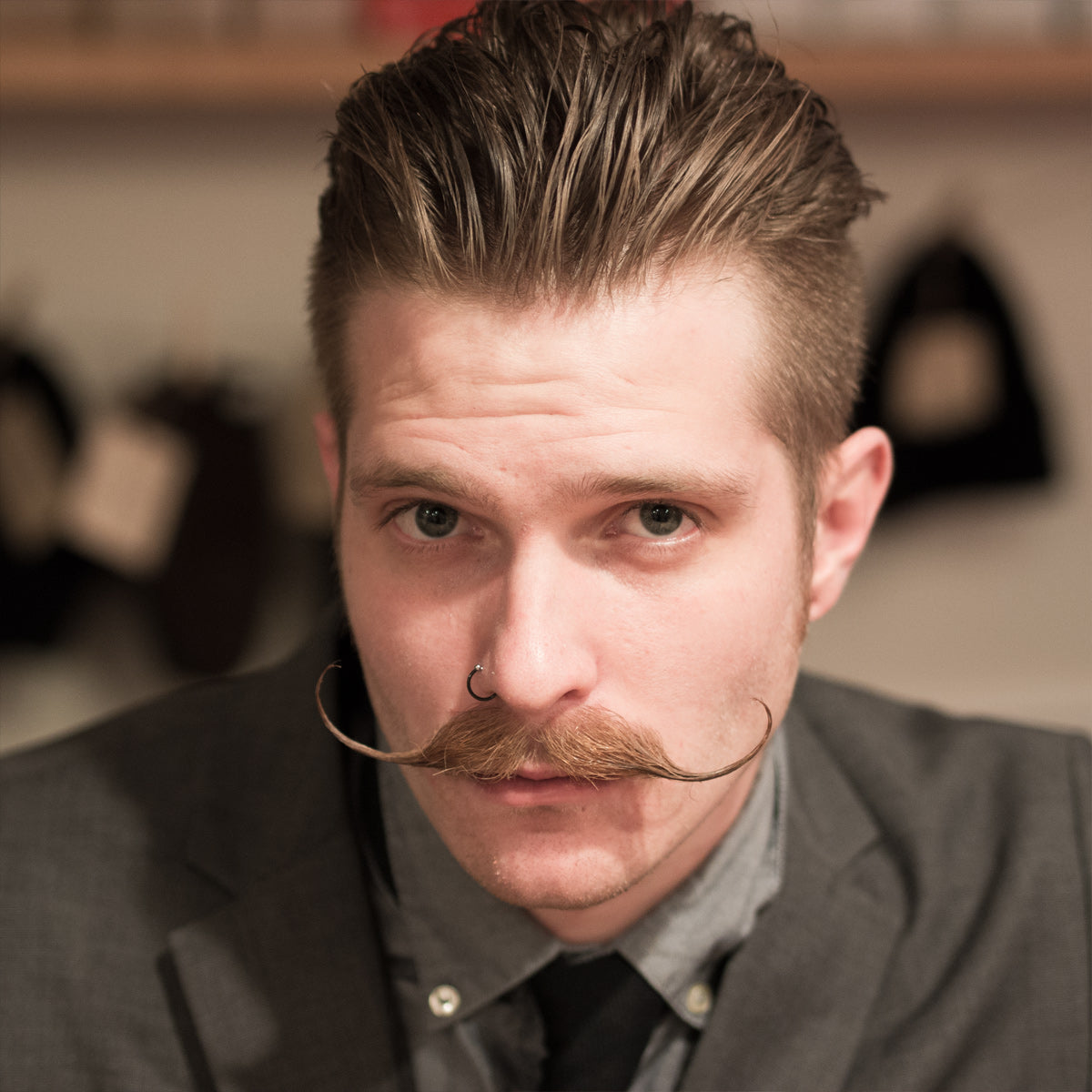 headshot of a man with a handlebar mustache