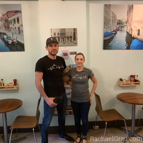 Happy 10th Birthday, CocoaLatte! Enrique and Cristina in front of artwork by Rachael Grad