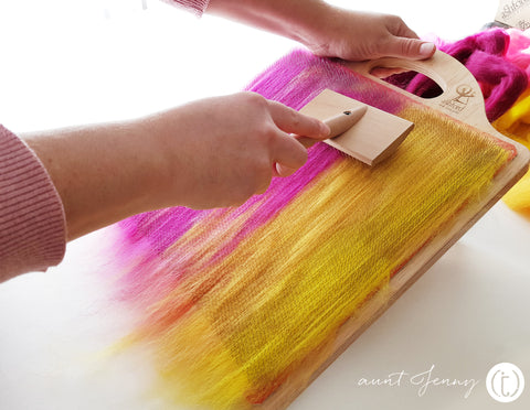 Brushing down  the fibres on the Ashford Blending Board with the blending brush