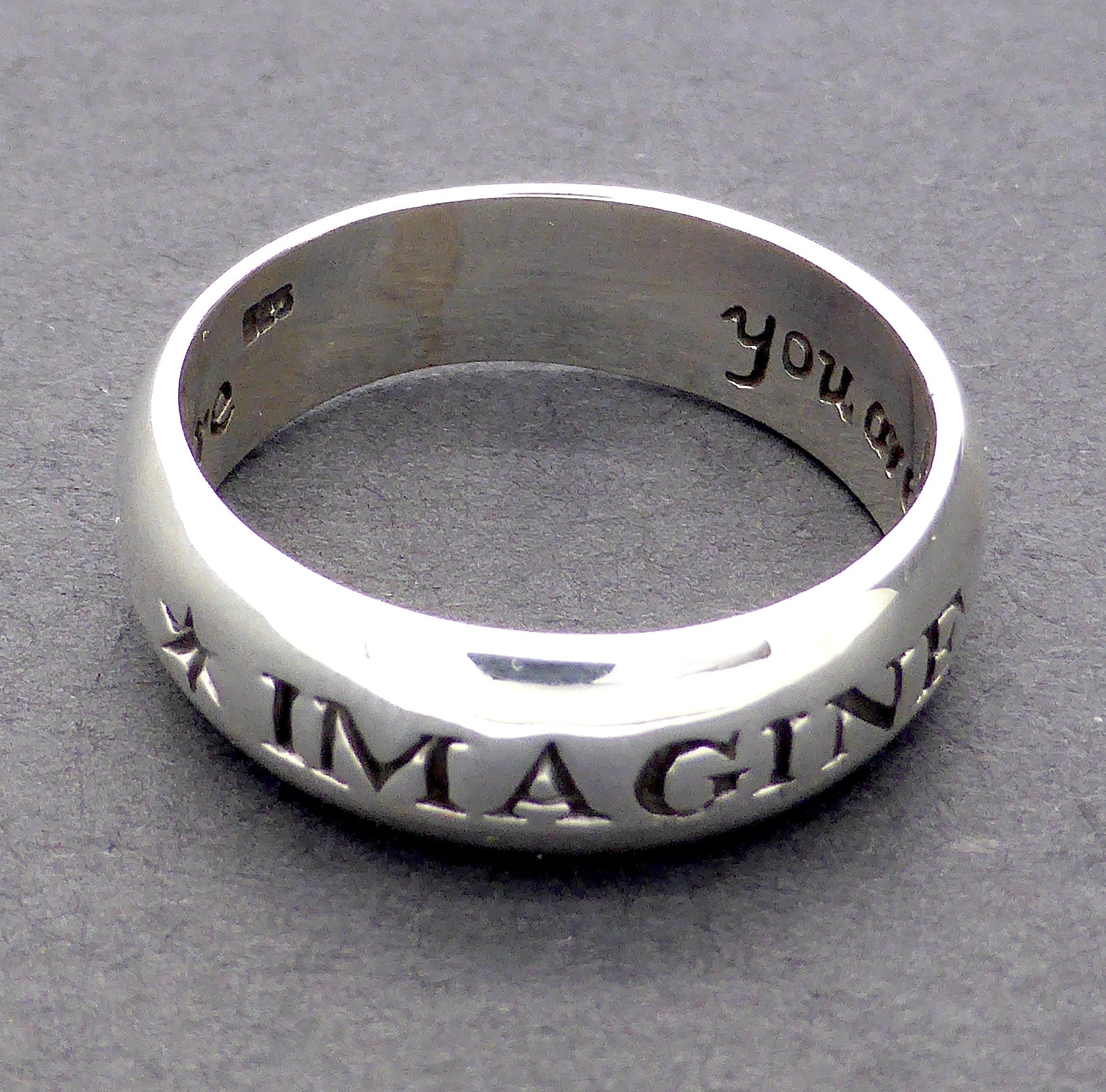 silver ring engraved inside