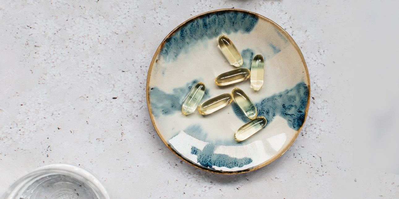 fish oil capsules on a dish