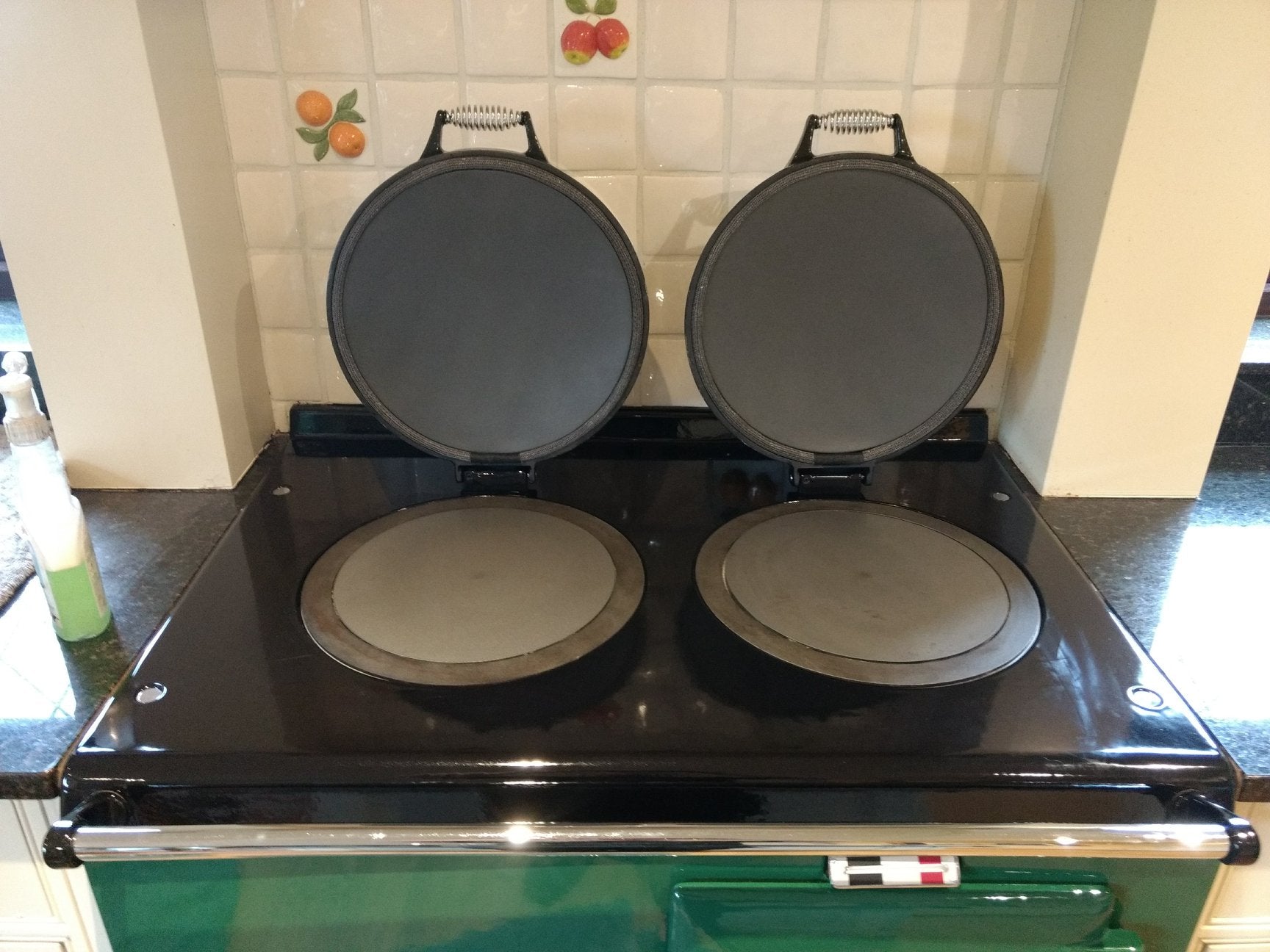 Green Aga range cooker with new non-stick lid liners