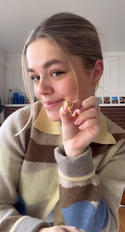 A girl showing her earrings