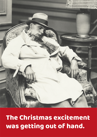 Christmas excitement was getting out of hand. Funny Christmas card showing a man asleep in an armchair