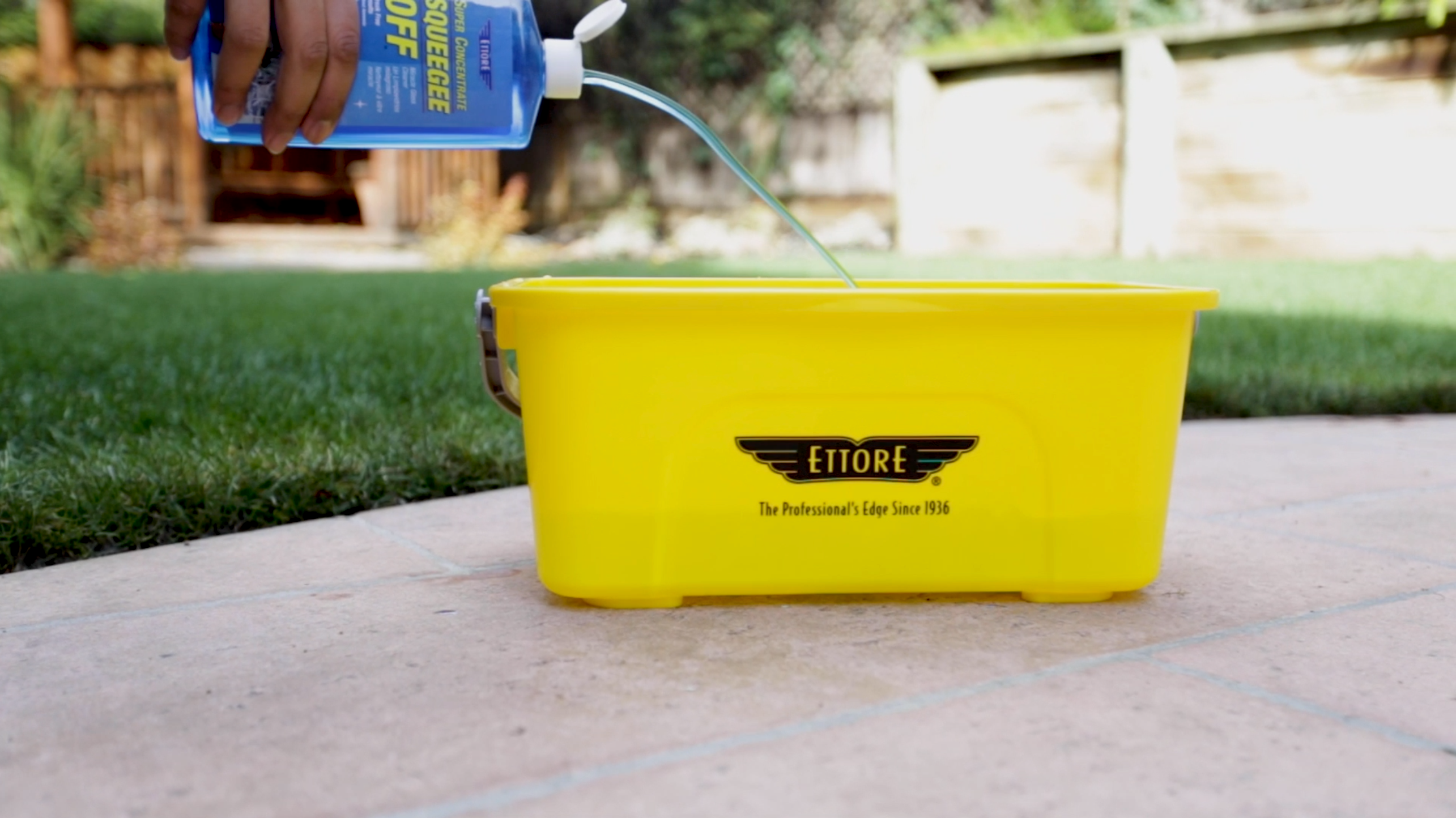 Squeegee Off Being Poured into Compact Bucket