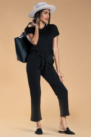 Woman wearing black motion tee and black berlin pants