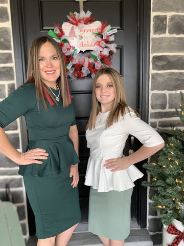 Woman posing in Peplum Dress with younger daughter wearing Peplum Top next to her