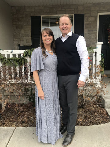 Woman wearing Splendor Dress standing next to husband
