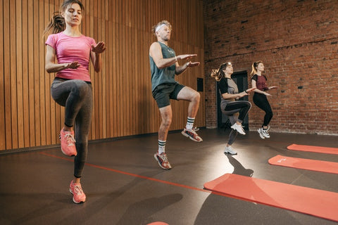 Fitness class with people doing aerobics