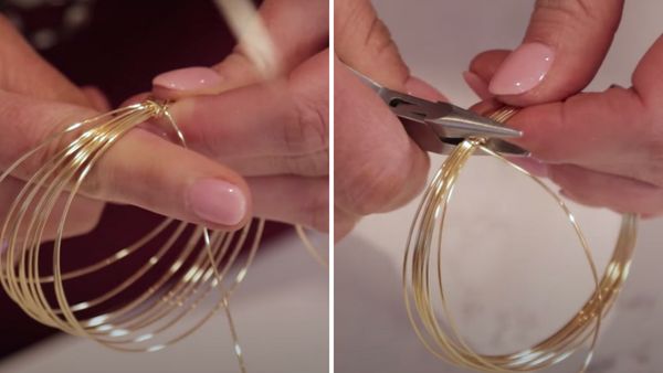 close up of wrapping wire around wire bangle to secure it and pliers flattening wire to secure it