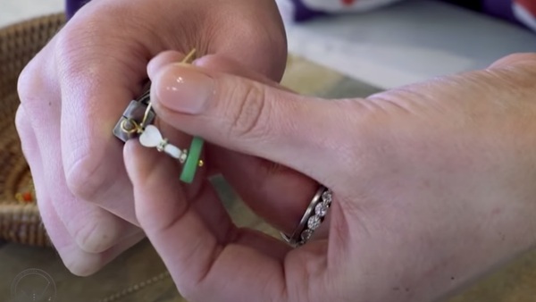 twisting a jewelry making headpin with pliers