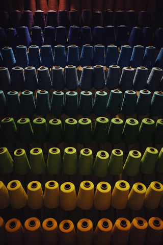 A large variety of coloured fabric in a clothing plant
