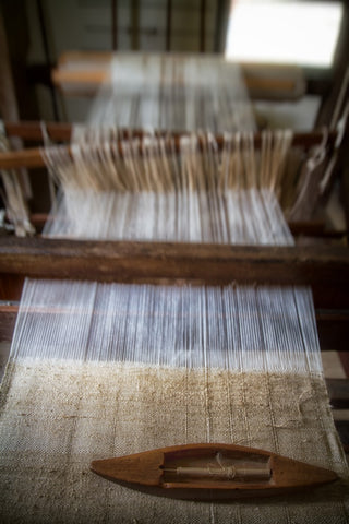 A loom of clothing material as part of slow fashion production