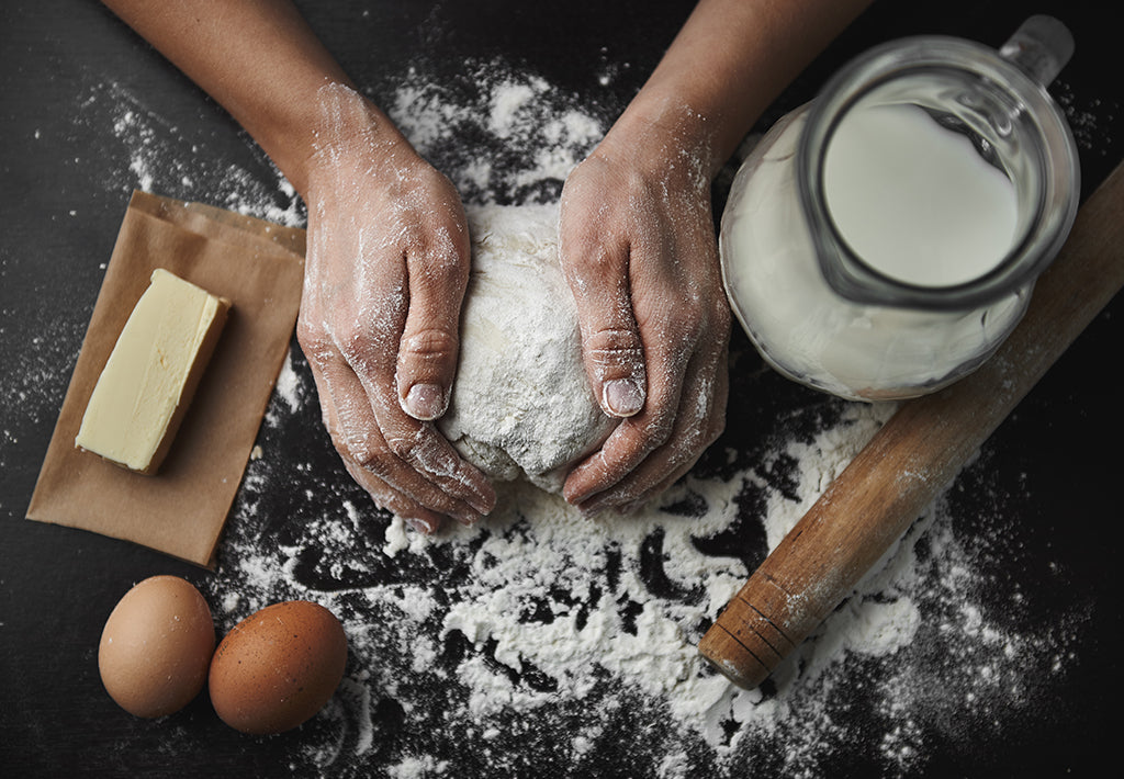 Floured hands forming cookie dough for our Boston General Store holiday cookie recipe.