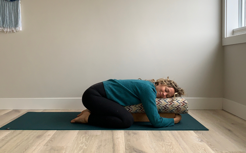 Supported Child's Pose with a bolster