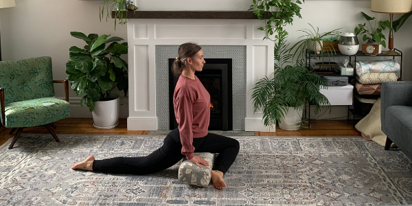 Pigeon Pose with a bolster for stability