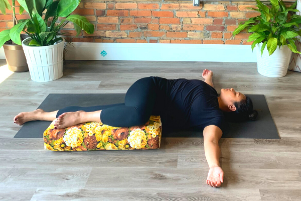 Supported Supine Twist Pose for easy Restorative Yoga