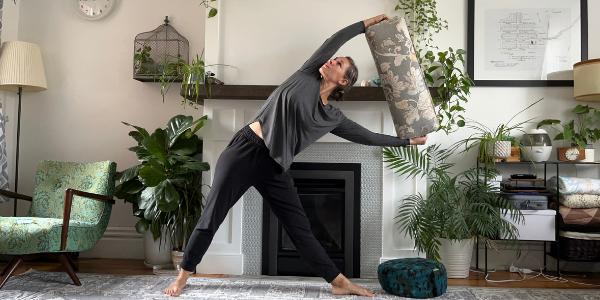 Triangle Pose with a bolster to strengthen core