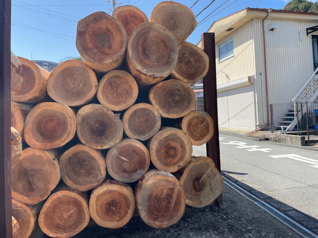 Yoshinosugi stacked up along the side of the road near Yoshitani Woodworks