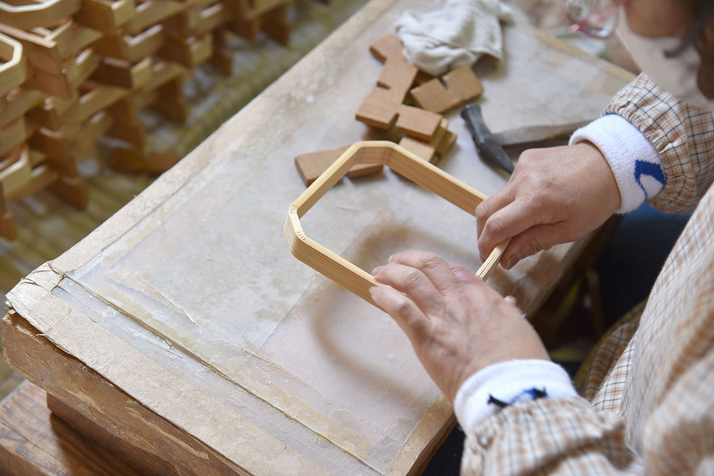 Worker bending wood