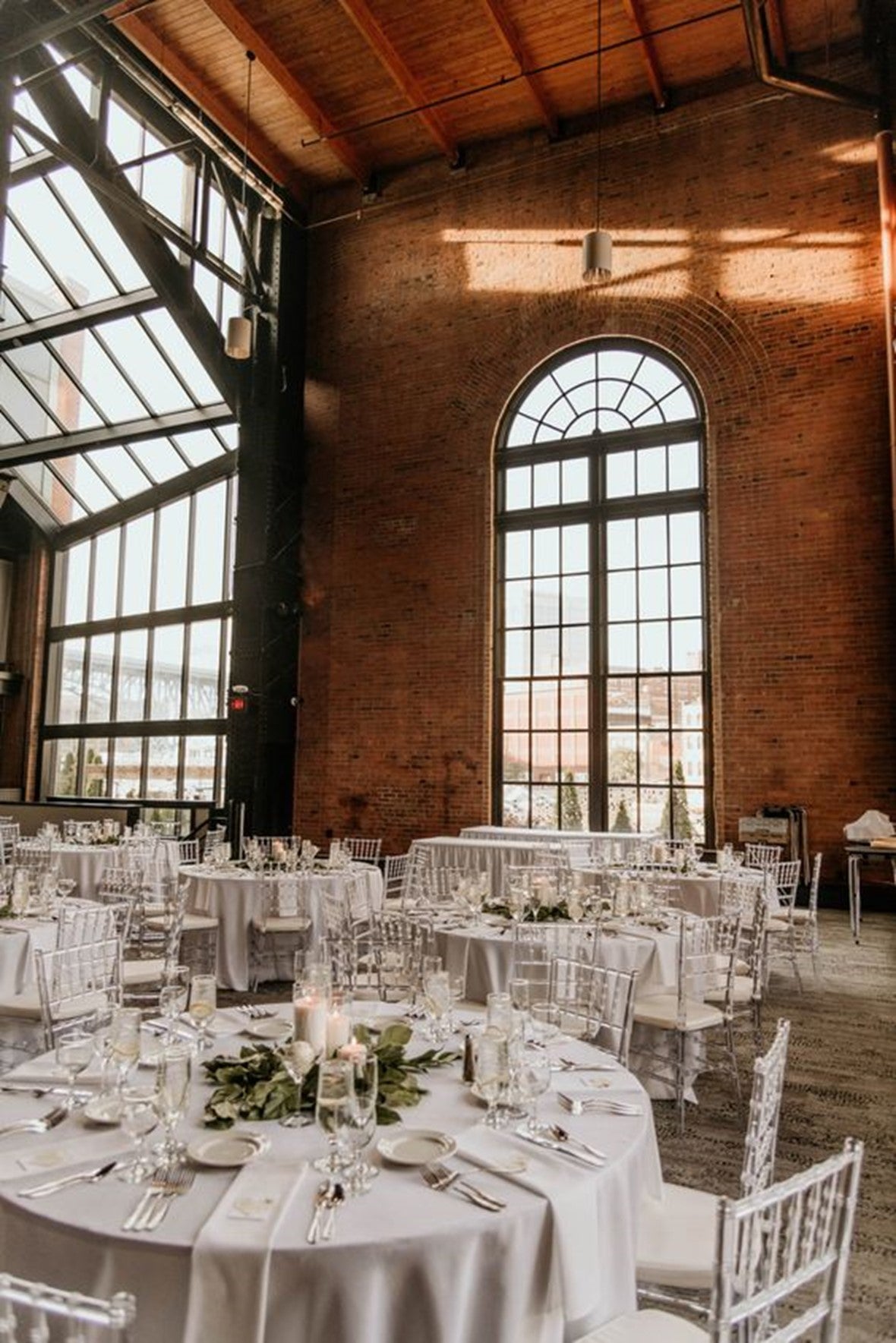 Top 10 2024 Wedding Decor Trends   Industrial Wedding Reception Space Is Oversized Windows And Brick Walls 