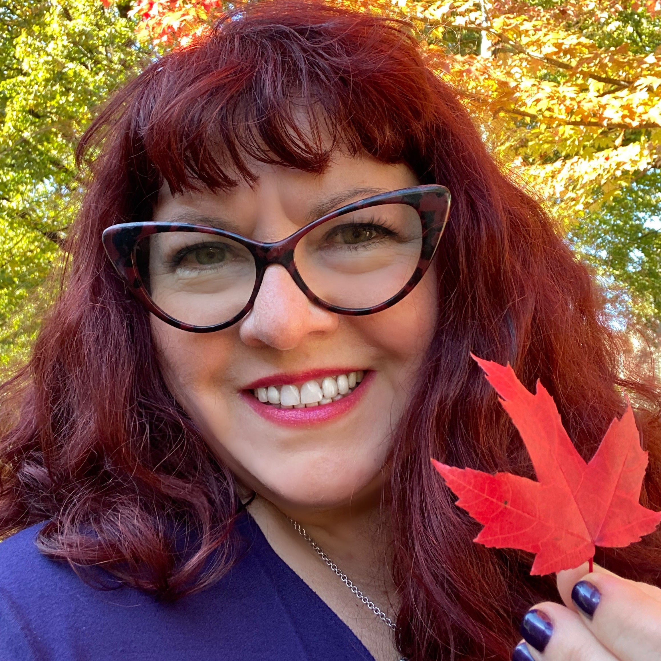 Canadian Designer Diane Kennedy holding a maple leaf