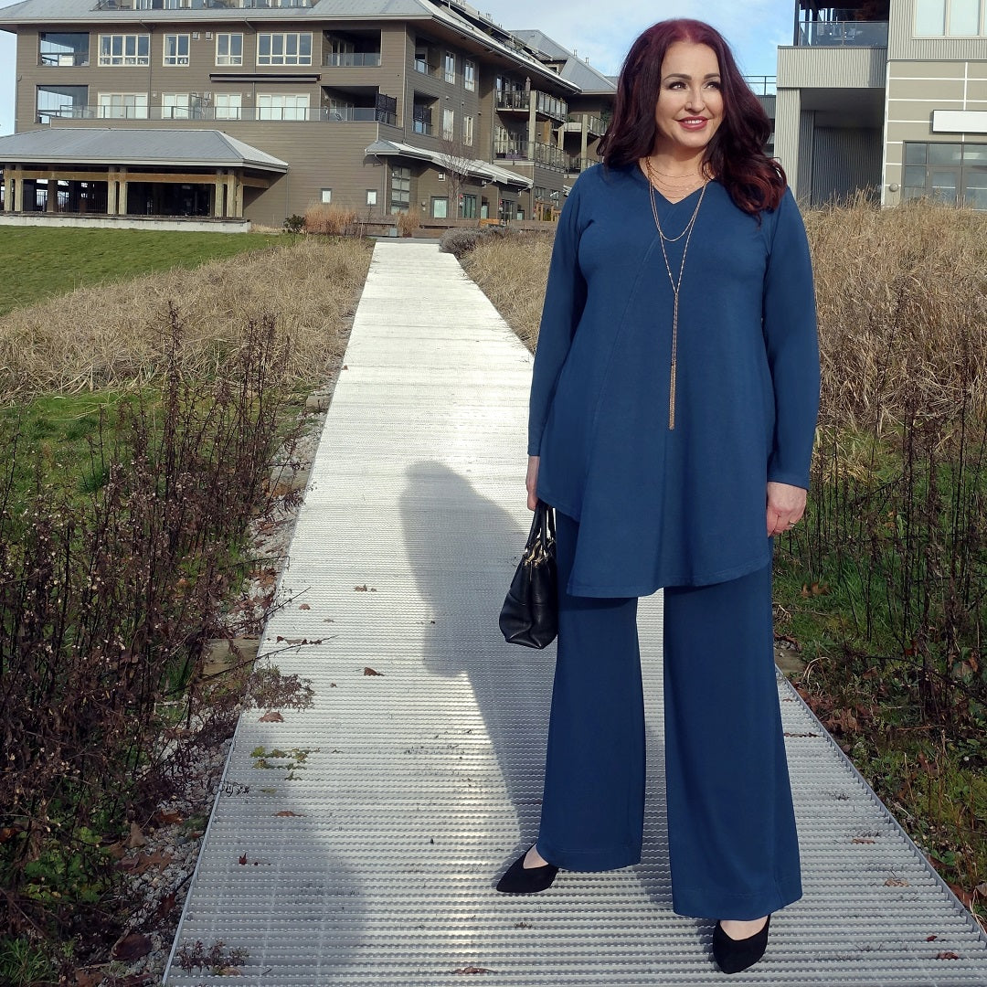 Red headed model wearing a sailor blue tunic and wide leg pant by Canadian designer Diane Kennedy