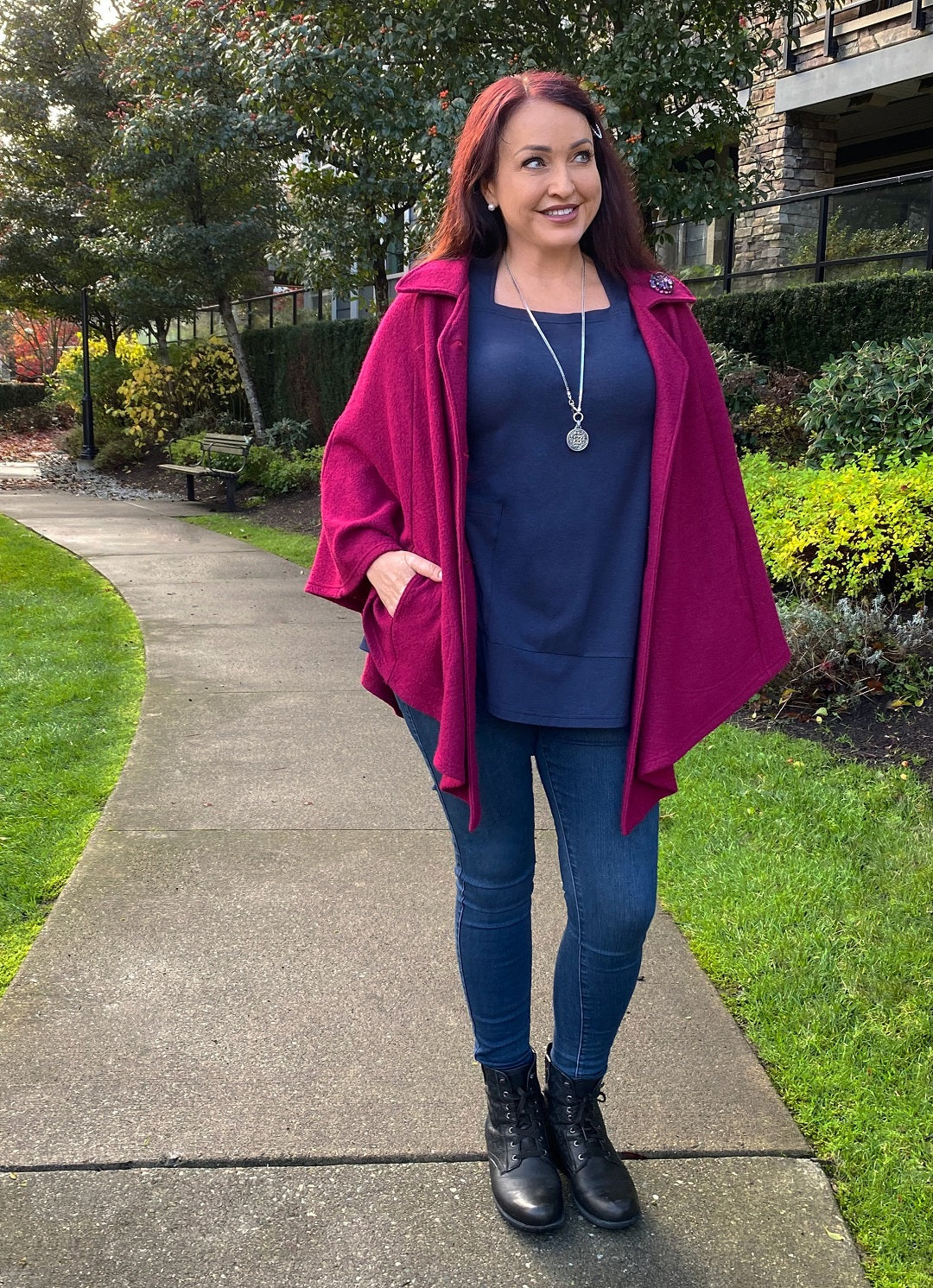 Leah Tuttle wears a Diane Kennedy Cape and Navy Tempo Tunic over jeans
