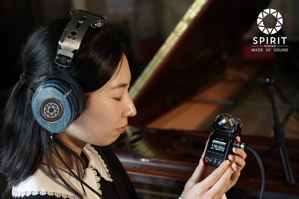 Woman listening to voice recorder with mistral radiante