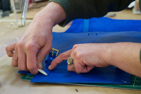 Assembling the Lotuff Leather Mini Sling backpack in electric blue