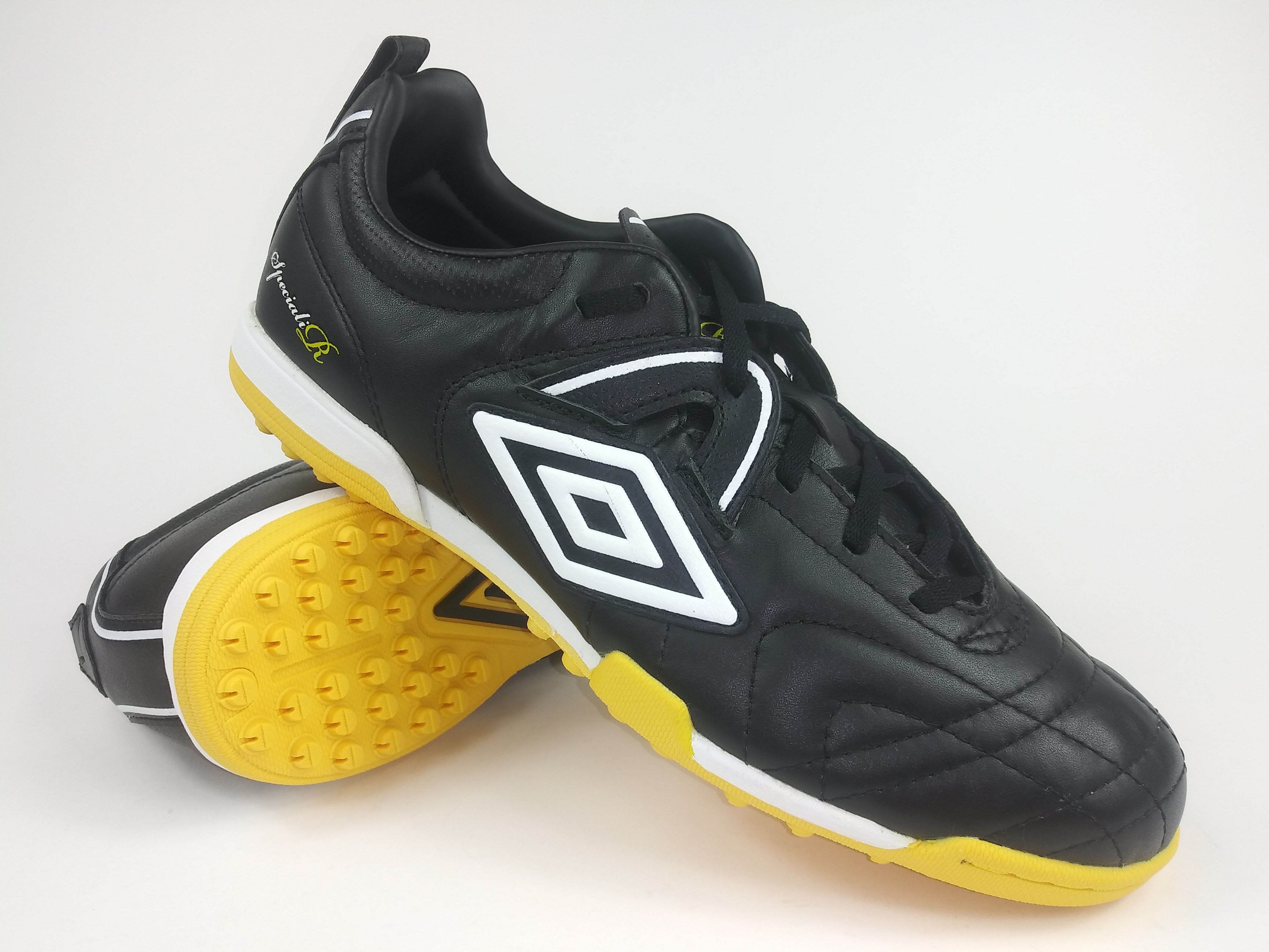 black and yellow turf shoes