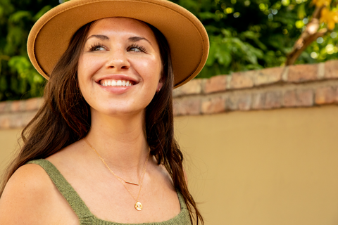 Girl With Layered Gold Necklaces