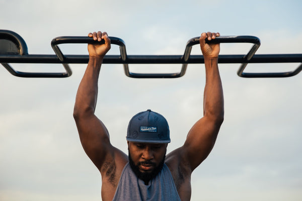 man with beard working out in summer