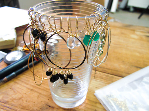 hanging earrings from cups easy DIY at home solutions for jewelry storage or jewelry storage while on the road