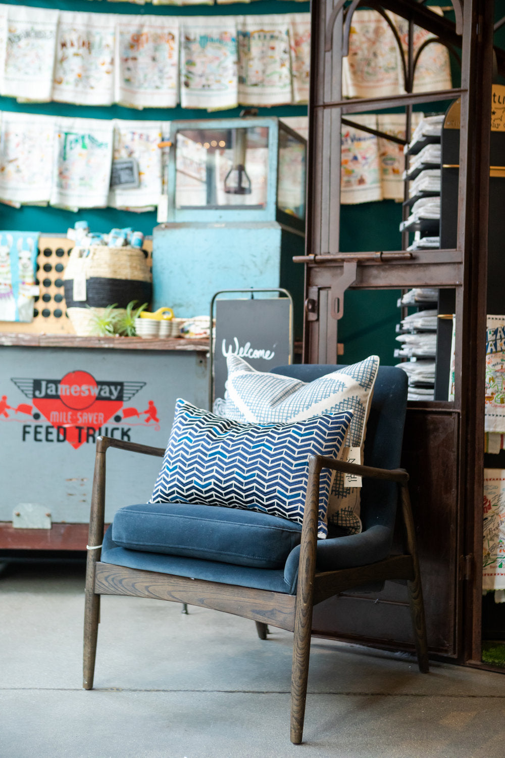 Wooden chair with blue patterned pillows