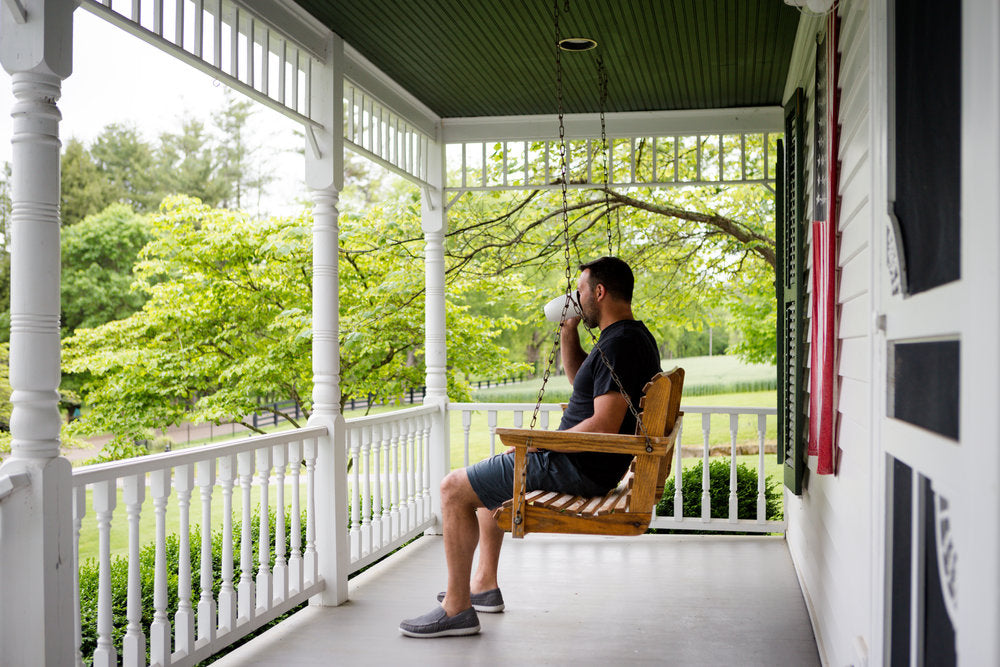 Daniel sitting on the front porch