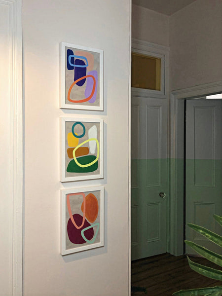 Three Abstract Art pop prints on the wall