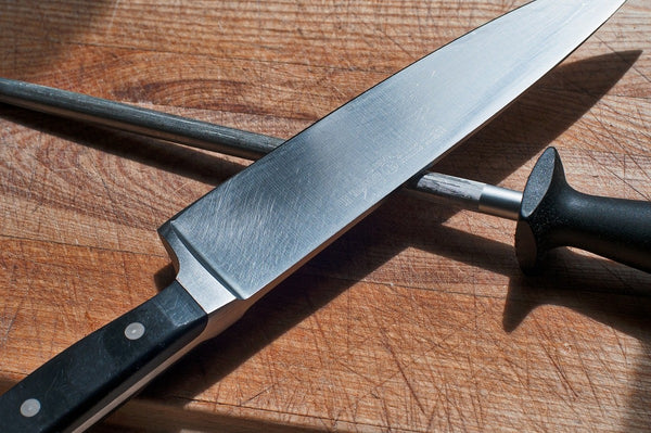 Chef's professional knife and a honing steel