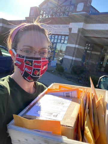 Woman in Ponya Bands Non-Slip Headband and has delivering packages to post office