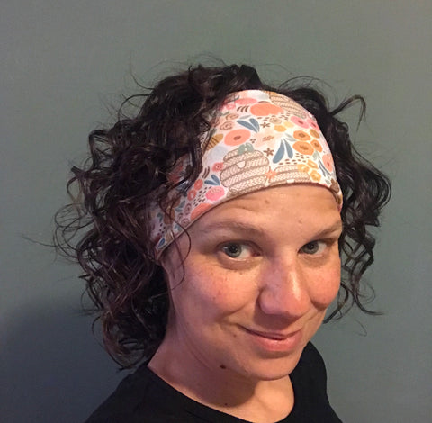 Woman with curly hair in Bamboo Jersey Lined Sweatband