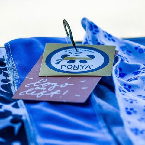 Close up of Ponya Bands' Non-Slip Headband with Logo on the Left tag
